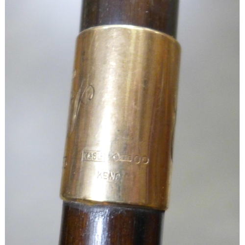 796 - Two walking sticks with horn handles and 9ct gold mounts - both monogrammed and one engraved 1933