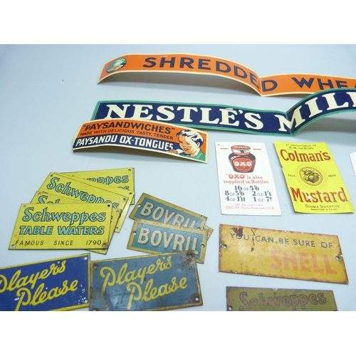 803 - A collection of Bassett-Lowke mid-20th Century model rail tin-plate advertising signs and some paper... 