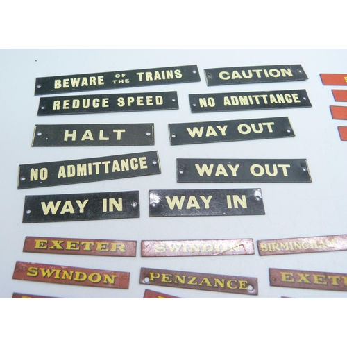 804 - A collection of Bassett-Lowke mid 20th Century model rail tin-plate signs, London locations, railway... 