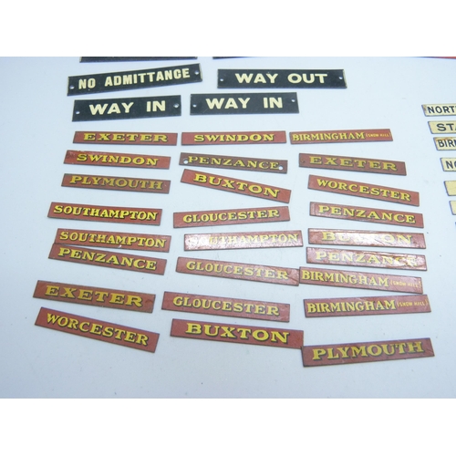 804 - A collection of Bassett-Lowke mid 20th Century model rail tin-plate signs, London locations, railway... 