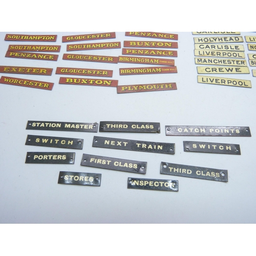 804 - A collection of Bassett-Lowke mid 20th Century model rail tin-plate signs, London locations, railway... 