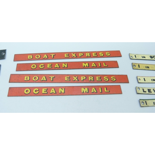 804 - A collection of Bassett-Lowke mid 20th Century model rail tin-plate signs, London locations, railway... 