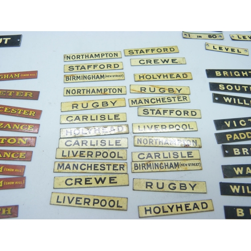 804 - A collection of Bassett-Lowke mid 20th Century model rail tin-plate signs, London locations, railway... 