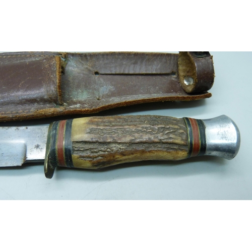 812 - A dagger with scabbard and an 'Original Bowie knife' lacking scabbard