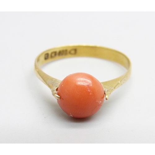 958 - A 22ct gold ring set with a cabochon coral, 2.5g, P