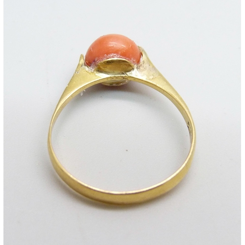 958 - A 22ct gold ring set with a cabochon coral, 2.5g, P