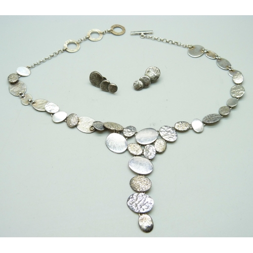 963 - A Chris Lewis silver necklace and earrings set