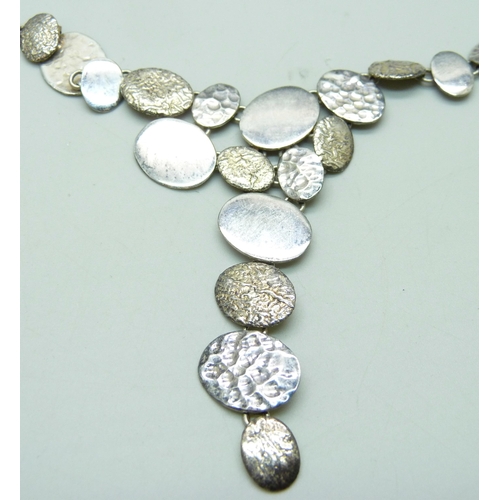 963 - A Chris Lewis silver necklace and earrings set