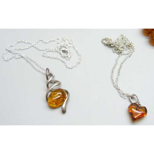 976 - A collection of silver and amber jewellery;- three necklaces, a bead necklace, a brooch and a pair o... 