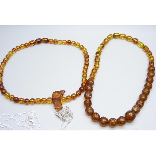 976 - A collection of silver and amber jewellery;- three necklaces, a bead necklace, a brooch and a pair o... 