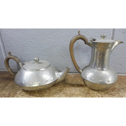 989 - A four piece pewter tea service and a tray