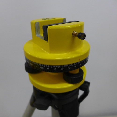 2102 - A laser level, tripod stand, a spirit level and safety goggles