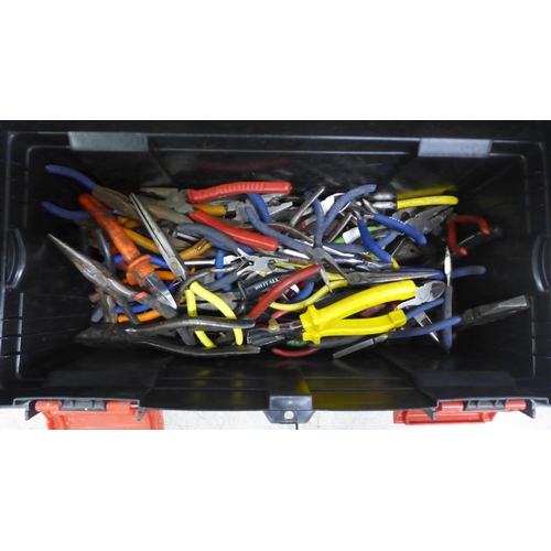 2106 - A plastic toolbox containing pliers, wire strippers, cutters, grips, etc.