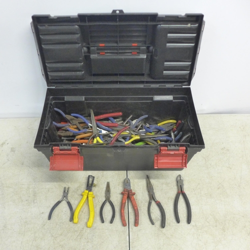 2106 - A plastic toolbox containing pliers, wire strippers, cutters, grips, etc.