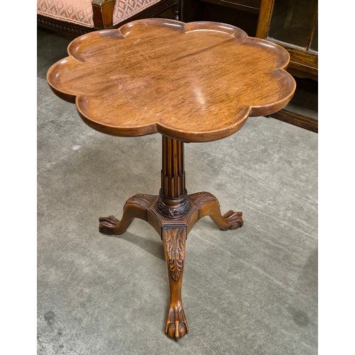 155A - A Chippendale style carved mahogany tripod wine table