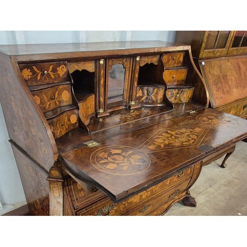 113 - An 18th Century Dutch mahogany and marquetry inlaid bombé shaped bureau