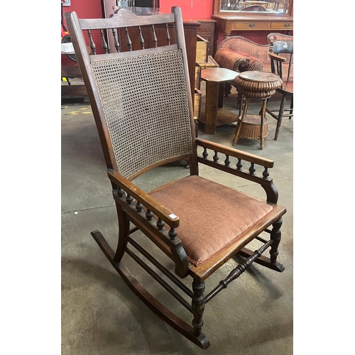 99 - A 19th Century American beech and bergere rocking chair