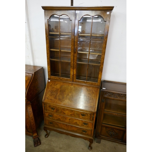 111 - A Queen Anne style burr walnut bureau bookcase