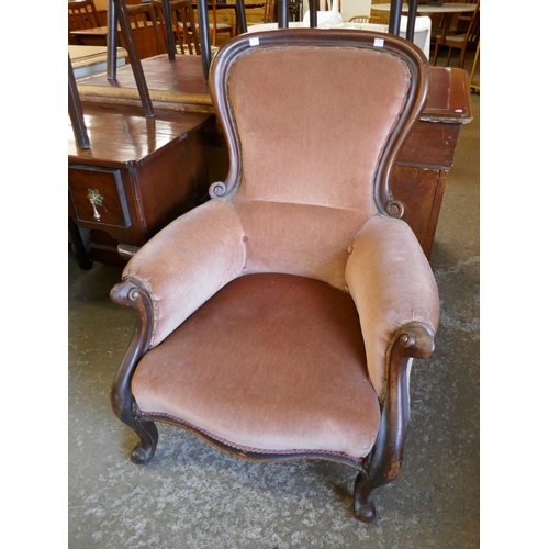 126 - A Victorian mahogany and fabric upholstered armchair