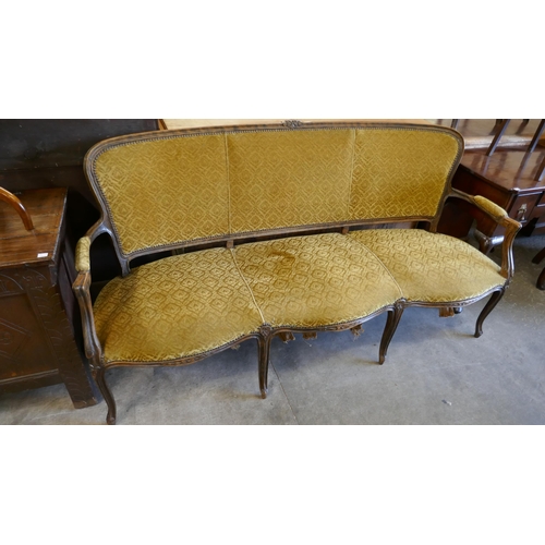 130 - An early 20th Century French carved beech and fabric upholstered canape settee