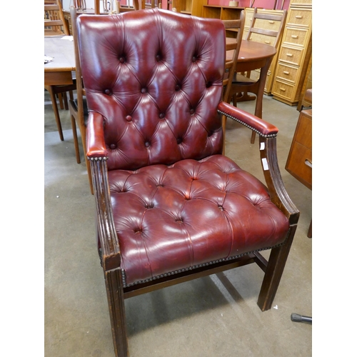 93 - A mahogany and oxblood red leather Gainsborough 
style library chair