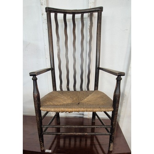 157 - An Arts and Crafts Morris & Co. beech and rush seated fireside chair