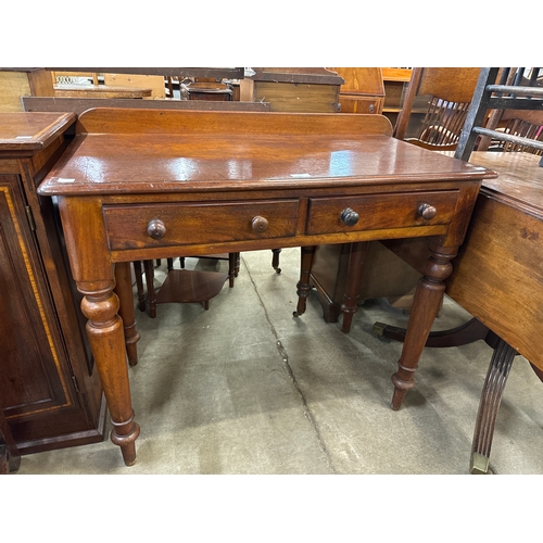 182 - A Victorian mahogany two drawer writing table