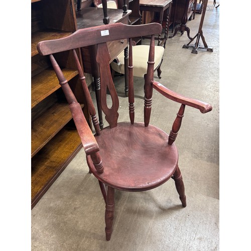 222 - A Victorian style elm and beech penny seat kitchen elbow chair