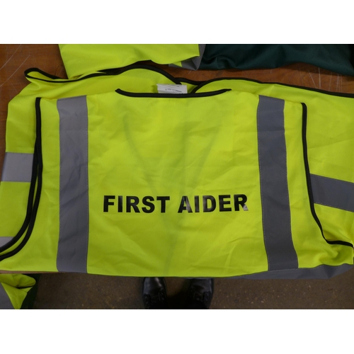 2384 - A bag of approx 20 First Aid hi-visibility vests in assorted sizes and styles