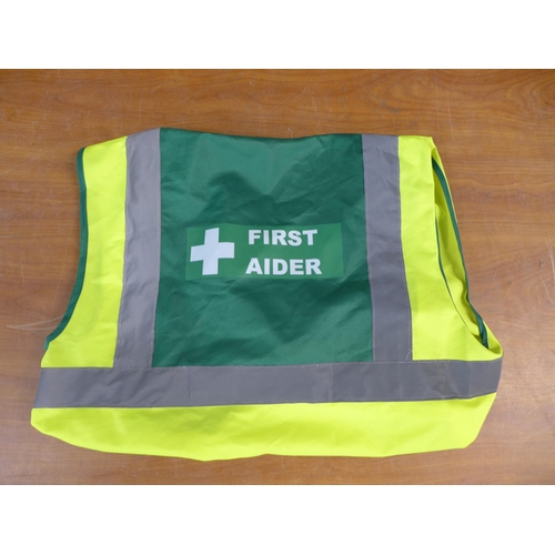 2384 - A bag of approx 20 First Aid hi-visibility vests in assorted sizes and styles