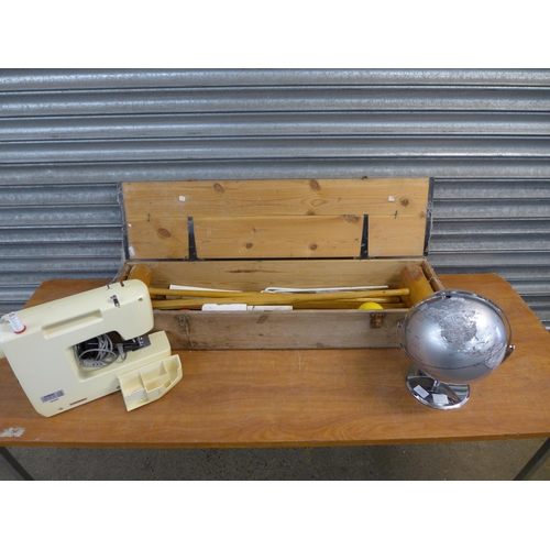 2398 - A County croquet set in a wooden case, a world globe and a Brother 885-412 230V electric sewing mach... 