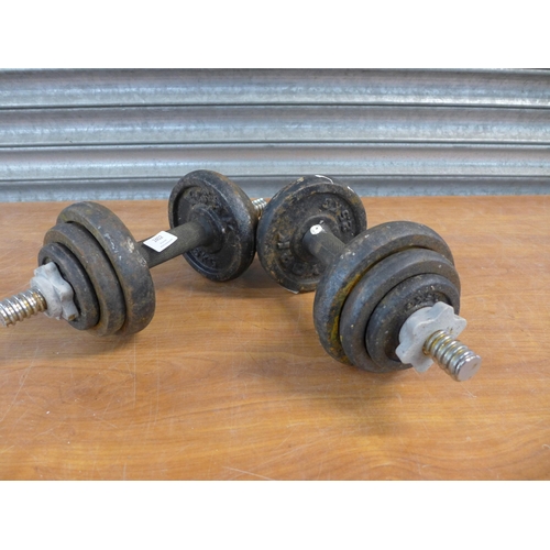 2402 - A pair of dumbbell bars with cast metal weights