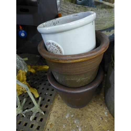 2415 - A large collection of assorted planters including glazed, concrete and terracotta including some vin... 