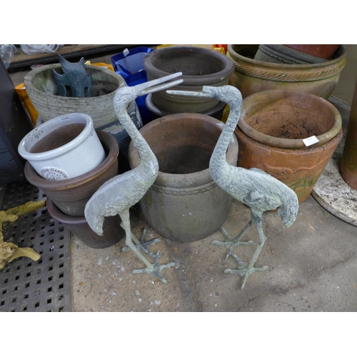 2415 - A large collection of assorted planters including glazed, concrete and terracotta including some vin... 