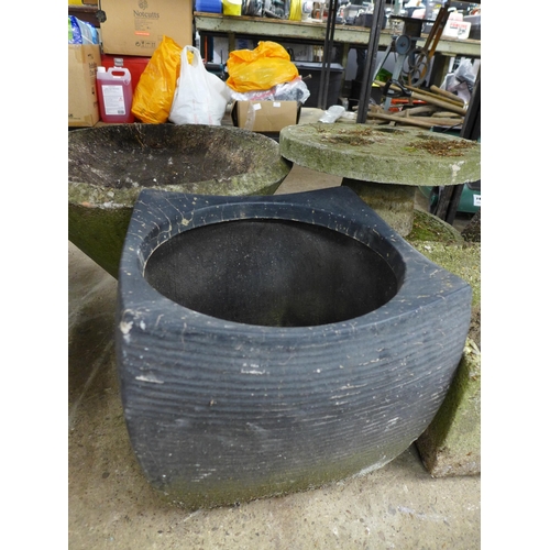 2418 - A large collection of assorted garden decorative items and planters including some stone