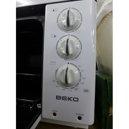 2420 - A Beko MC112W electronic compact cooker and a Morphy Richards mini fridge