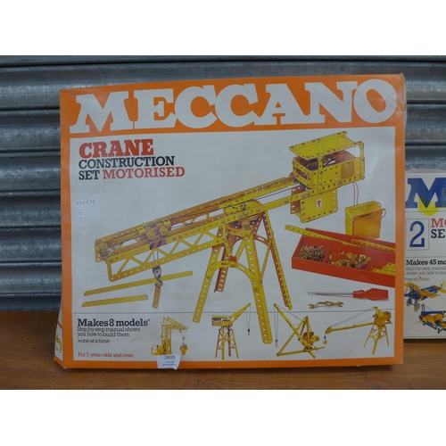 2433 - A large quantity of Meccano including motorized crane set, tool kit and other assorted Meccano parts... 