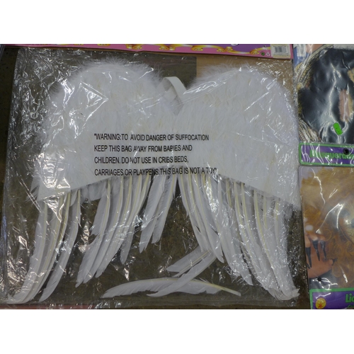 2442 - A box of joke shop items and 7 large dressing up angel wings