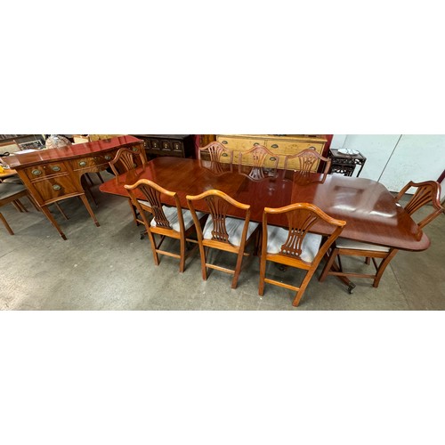 89 - A Regency style ten piece dining suite, comprising; extending pedestal dining table, sideboard and e... 