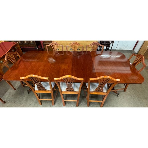 89 - A Regency style ten piece dining suite, comprising; extending pedestal dining table, sideboard and e... 