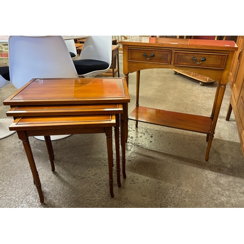 190 - A yew wood two drawer hall table and a nest of tables