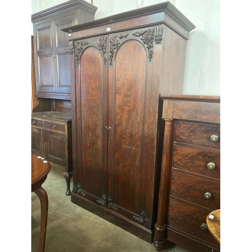 164 - A pair of Victorian carved mahogany linen press and wardrobe