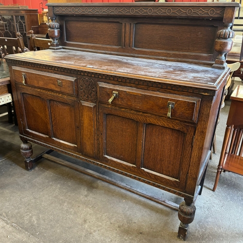 193 - A carved oak sideboard