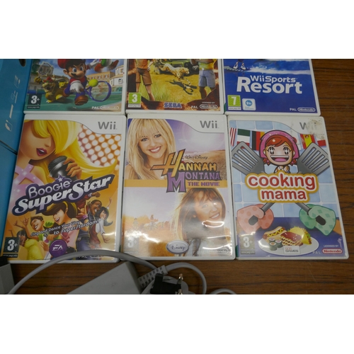 2200 - A Nintendo Wii Sports Resort pack with console and controller and a quantity of Wii games including ... 