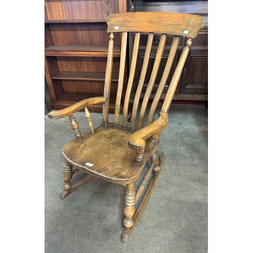 225 - A Victorian elm and beech rocking chair