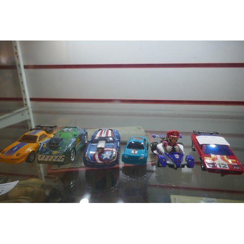 2207 - A small quantity of Scalextric, Carrera and other slot racing cars including Mario, Captain America,... 