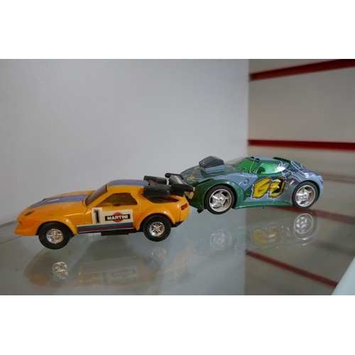 2207 - A small quantity of Scalextric, Carrera and other slot racing cars including Mario, Captain America,... 