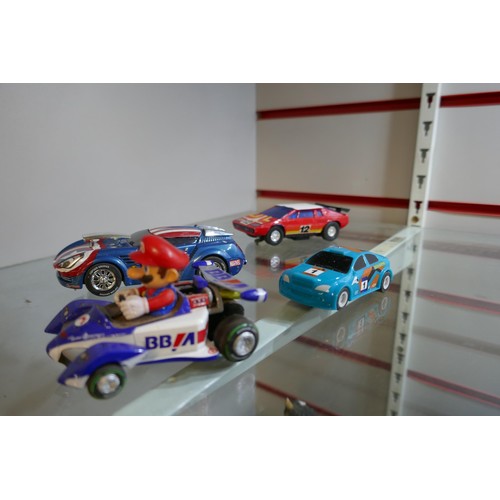 2207 - A small quantity of Scalextric, Carrera and other slot racing cars including Mario, Captain America,... 