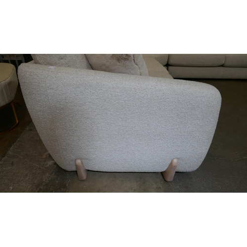 1409 - A large beige corner sofa on semi exposed frame - one odd cushion