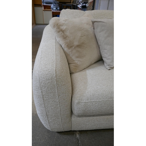 1409 - A large beige corner sofa on semi exposed frame - one odd cushion